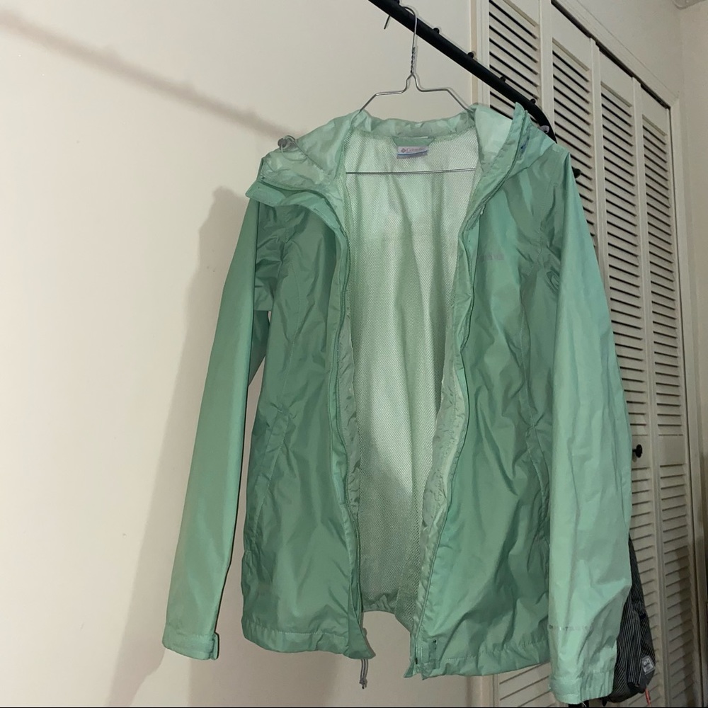 light green hooded Columbia windbreaker 💚